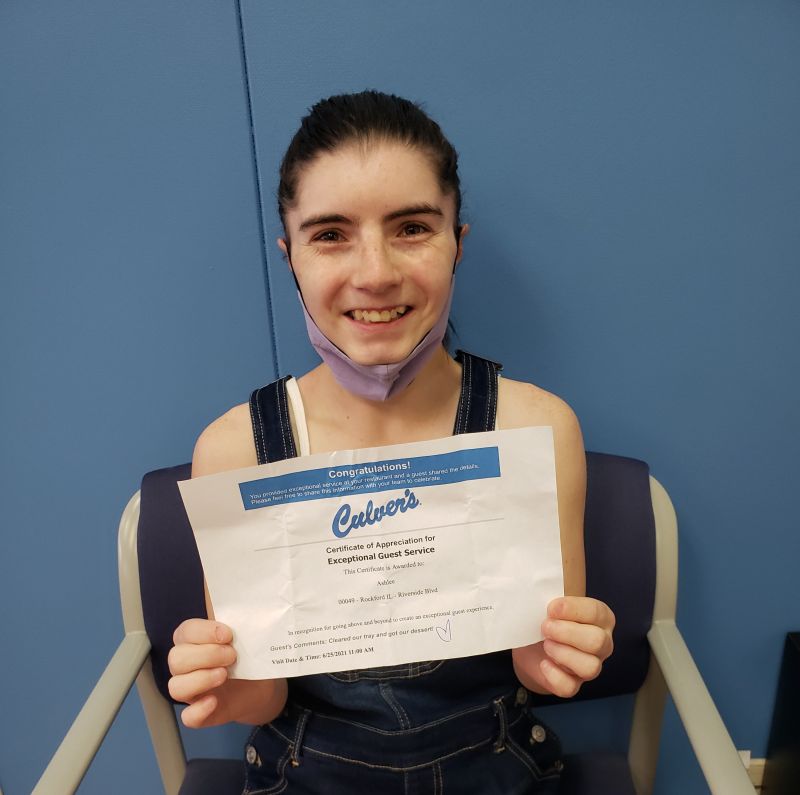 Young women holding a certificate